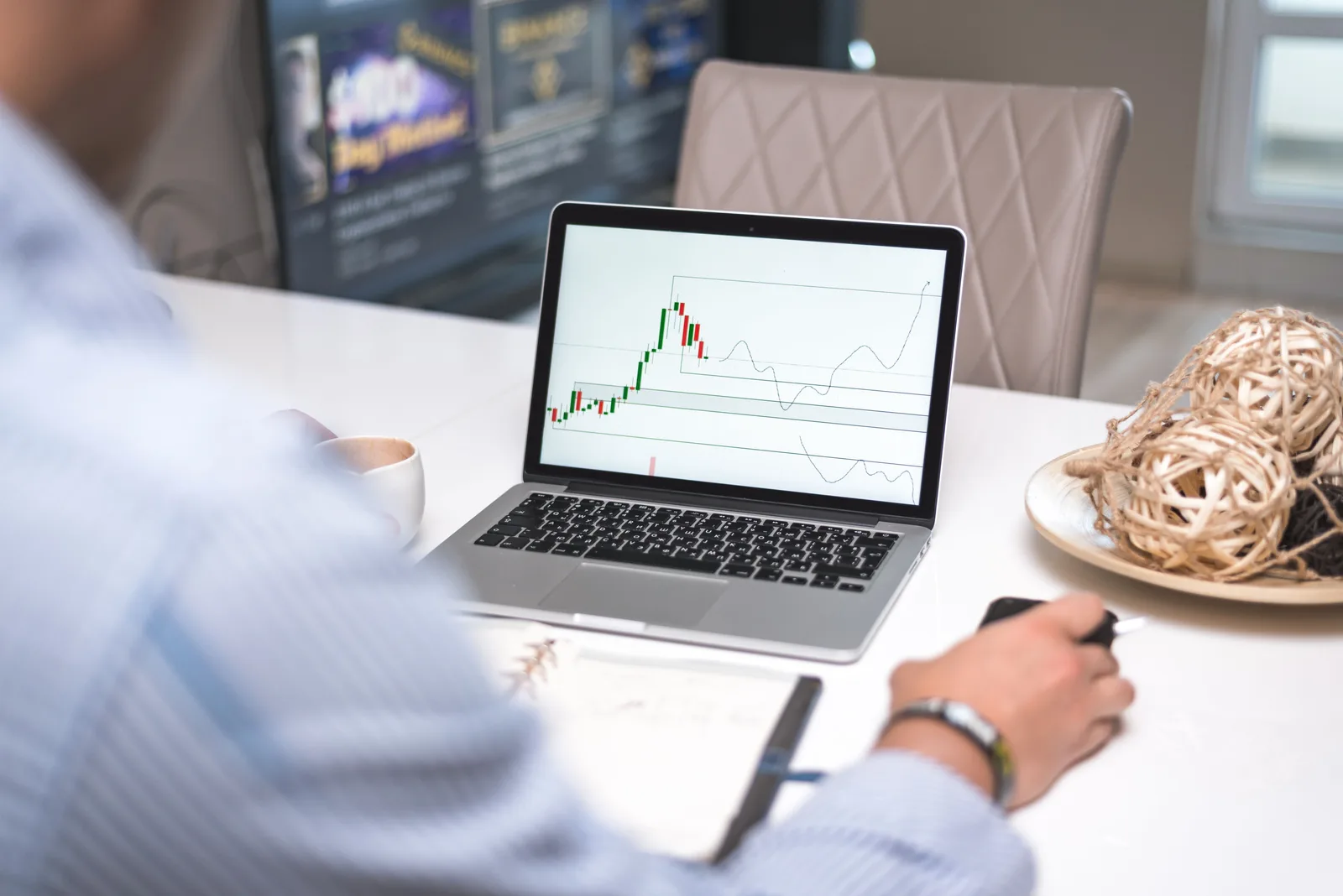 Man reviewing financial analysis on laptop in a modern office setting with focus on trading charts and data. The accounting software checklist that catches what audits miss