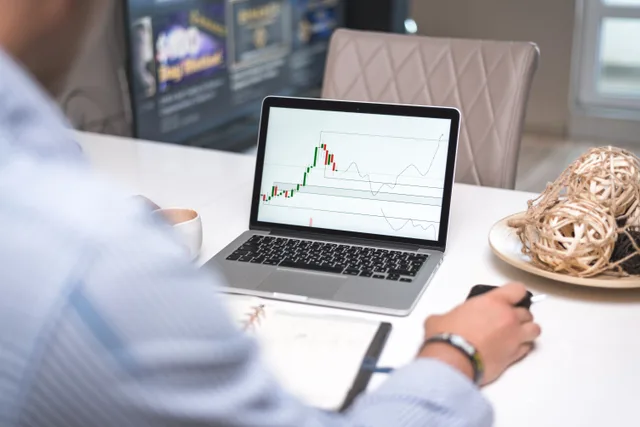 Man reviewing financial analysis on laptop in a modern office setting with focus on trading charts and data. The accounting software checklist that catches what audits miss