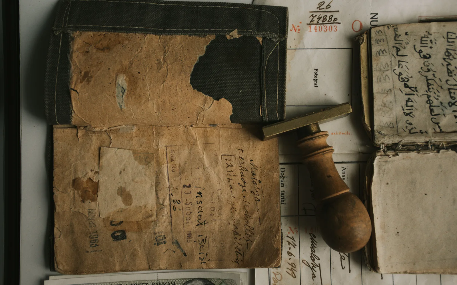 Top view of vintage documents and a wooden stamp, showcasing historical writing and paper textures. Accounts payable framework: who holds which payment gate