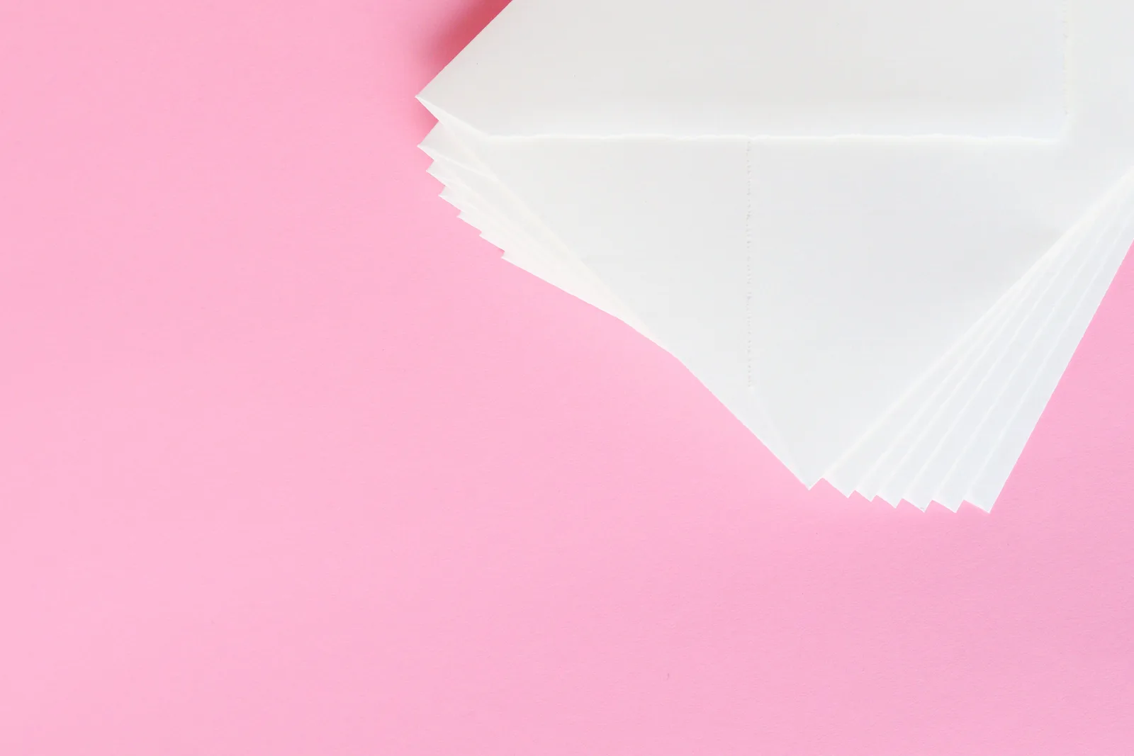 A stack of white papers on a pink background, perfect for business or creative projects. Accounts payable metrics for a small business, grouped by what each one protects