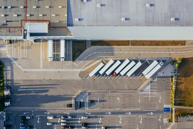 production, facility, logistic, distribution center, transit, truck, transport, top view, industrial, semi, aerial view, heavy, depot, germany, warehouse, container truck, shipping containers, storehouse, road, loading bay, factory, unloading, distribute, unload, europe, aerial photography, production, logistic, truck, truck, warehouse, warehouse, warehouse, warehouse, warehouse. Cross-border bookkeeping for US sellers shipping into Canada: GST/HST, customs and currency entries